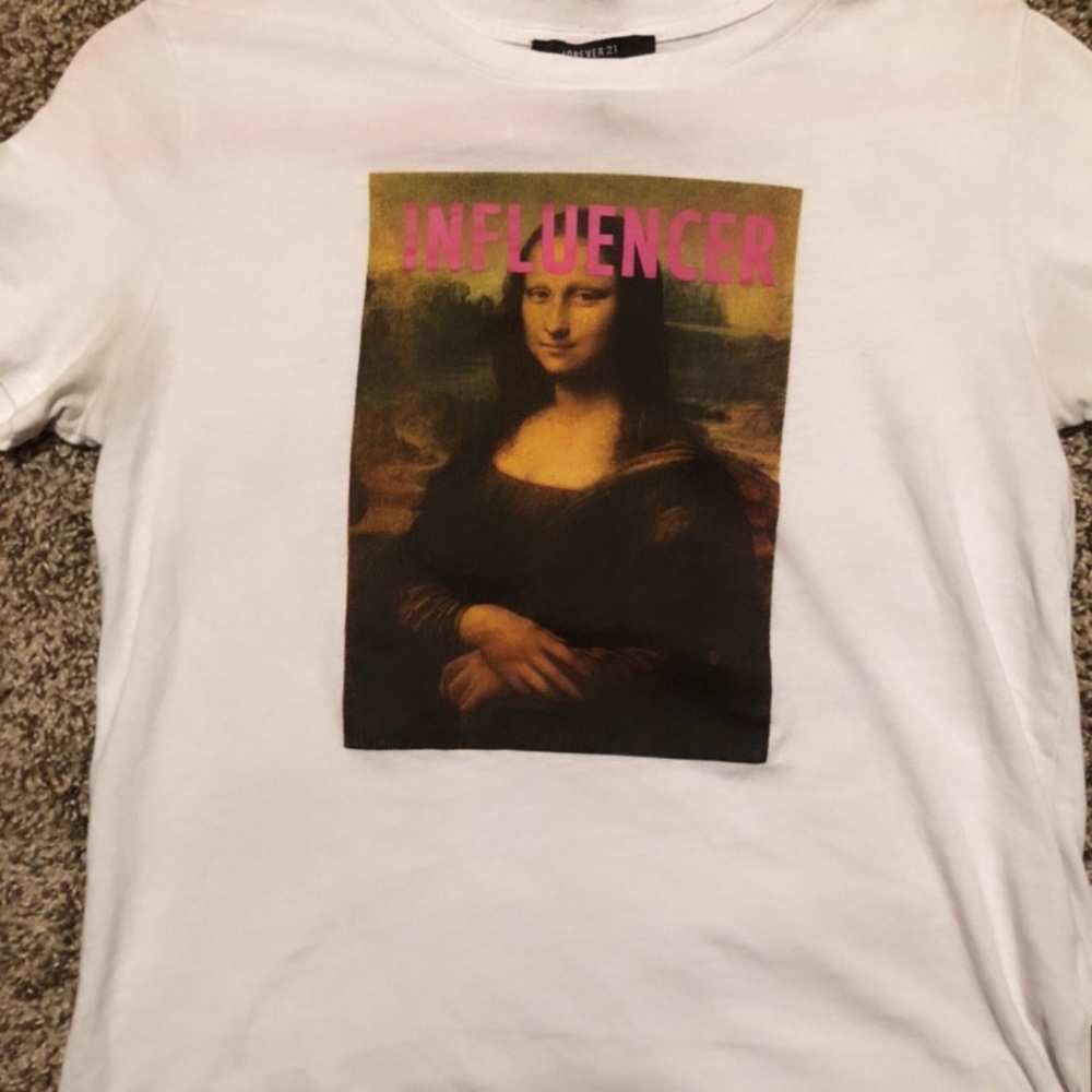 White “INFLUENCER” graphic tee.